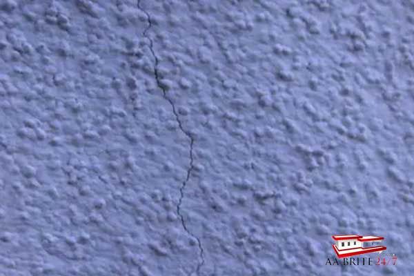 Cracked sanded stucco